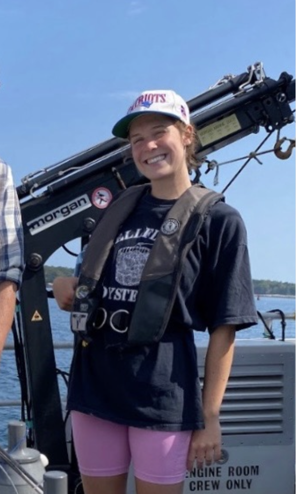 Caitlin Haley on the deck of a boat